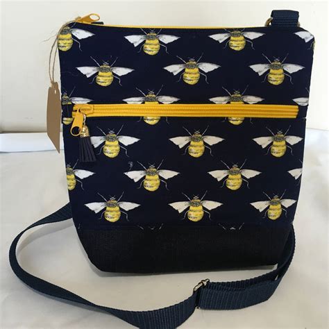 purse with bumble bee logo